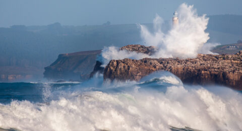 Giant wave jumped over the Faro de Mouro, in Santander. Spain