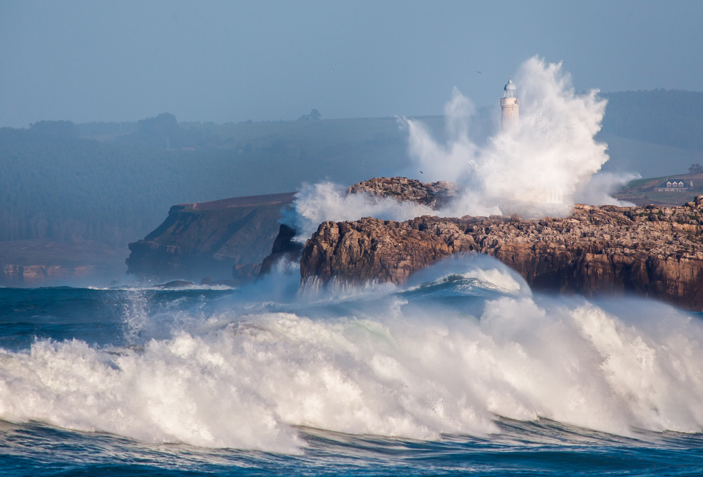 Giant wave jumped over the Faro de Mouro, in Santander. Spain